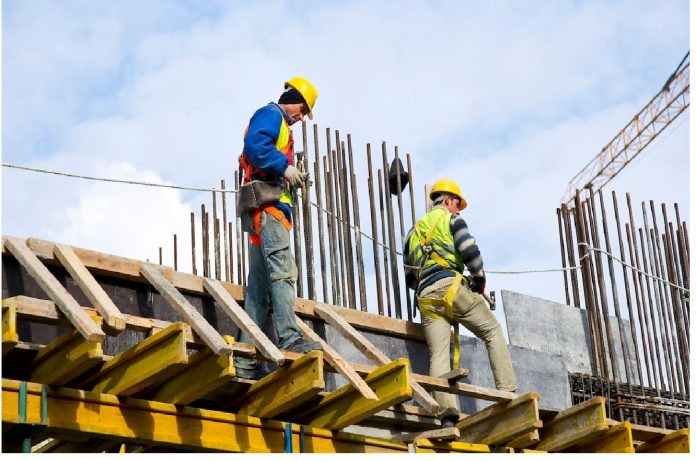 Photos of technicians on a building